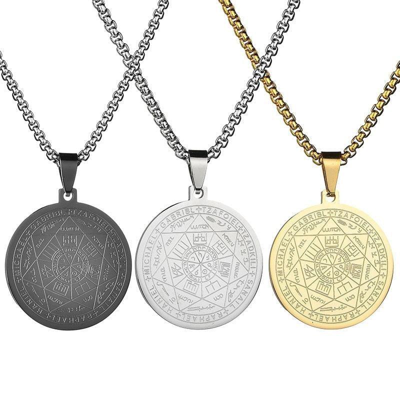 Three round pendant necklaces in gold, silver, and black with engraved mystical symbols.