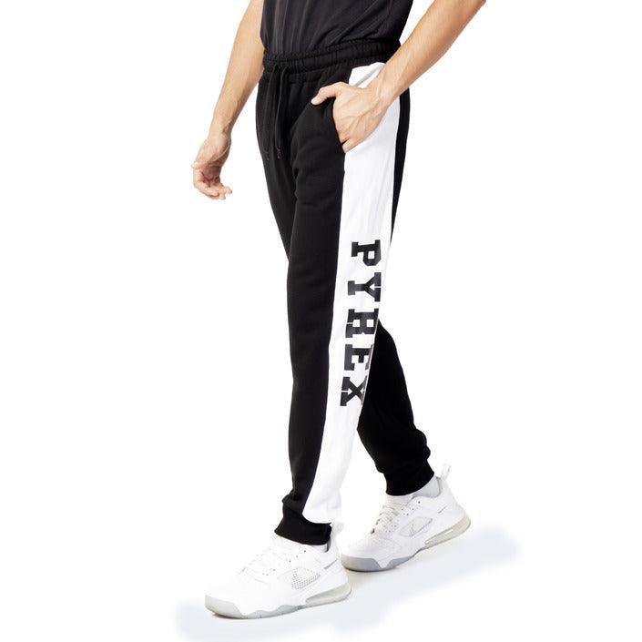 Man wearing black and white Pyrex jogger pants and white sneakers